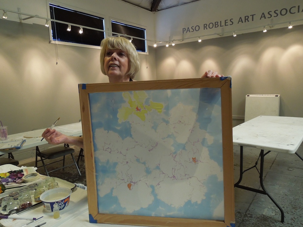 Liv Hansen demonstrates painting on silk in PRAA Classroom at Studios on the Park 